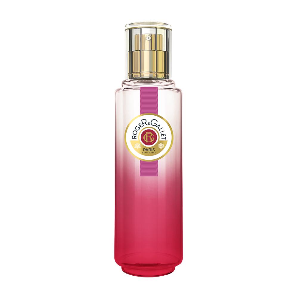 Rotes Parfümfläschchen mit goldener Kappe und Label in der Mitte.
