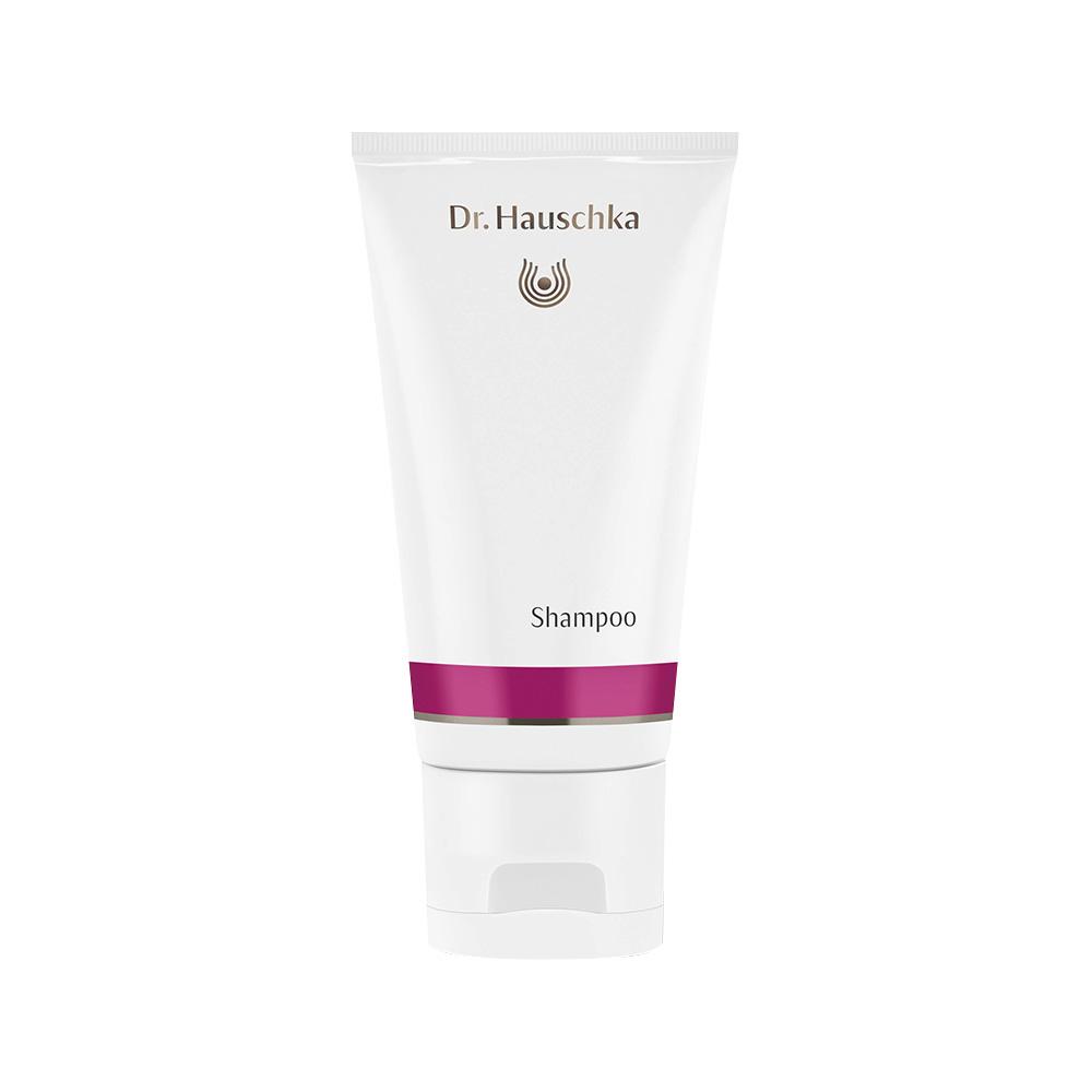 Weiße Shampooflasche mit rosa Streifen und Schriftzug "Dr. Hauschka".